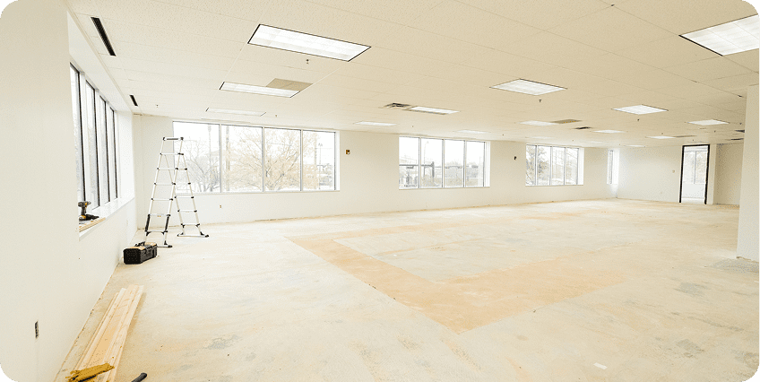 Bright, unfinished room with ladder